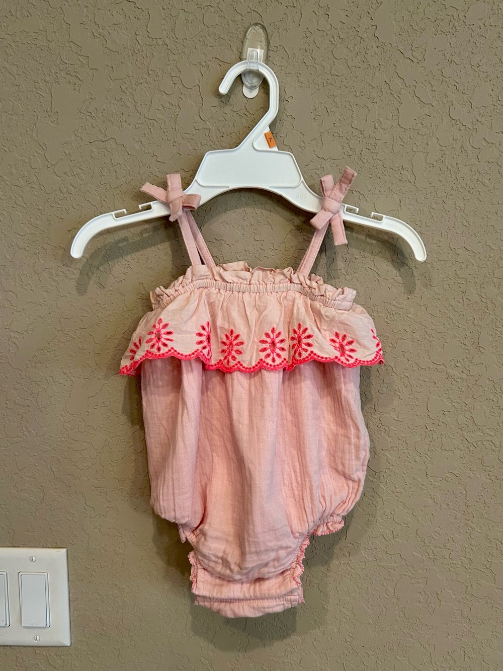 Baby GAP pink crinkle gauze romper with embroidered ruffle details